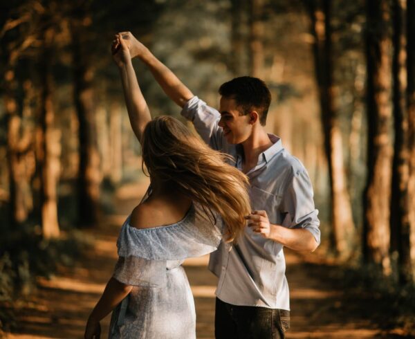 young couple dancing outdoors